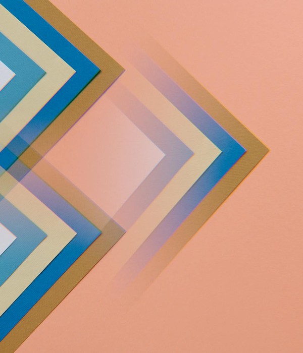 Abstract design featuring overlapping geometric shapes in soft pastel colors on a peach background.